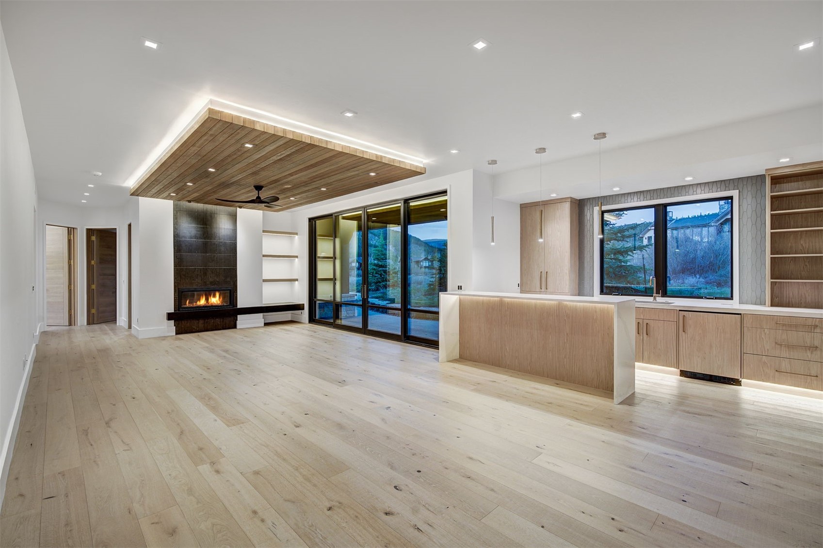 294 Gold Run Road Breckenridge, CO 80424 - Photo 40 of 49 a view of an empty room with wooden floor and windows
