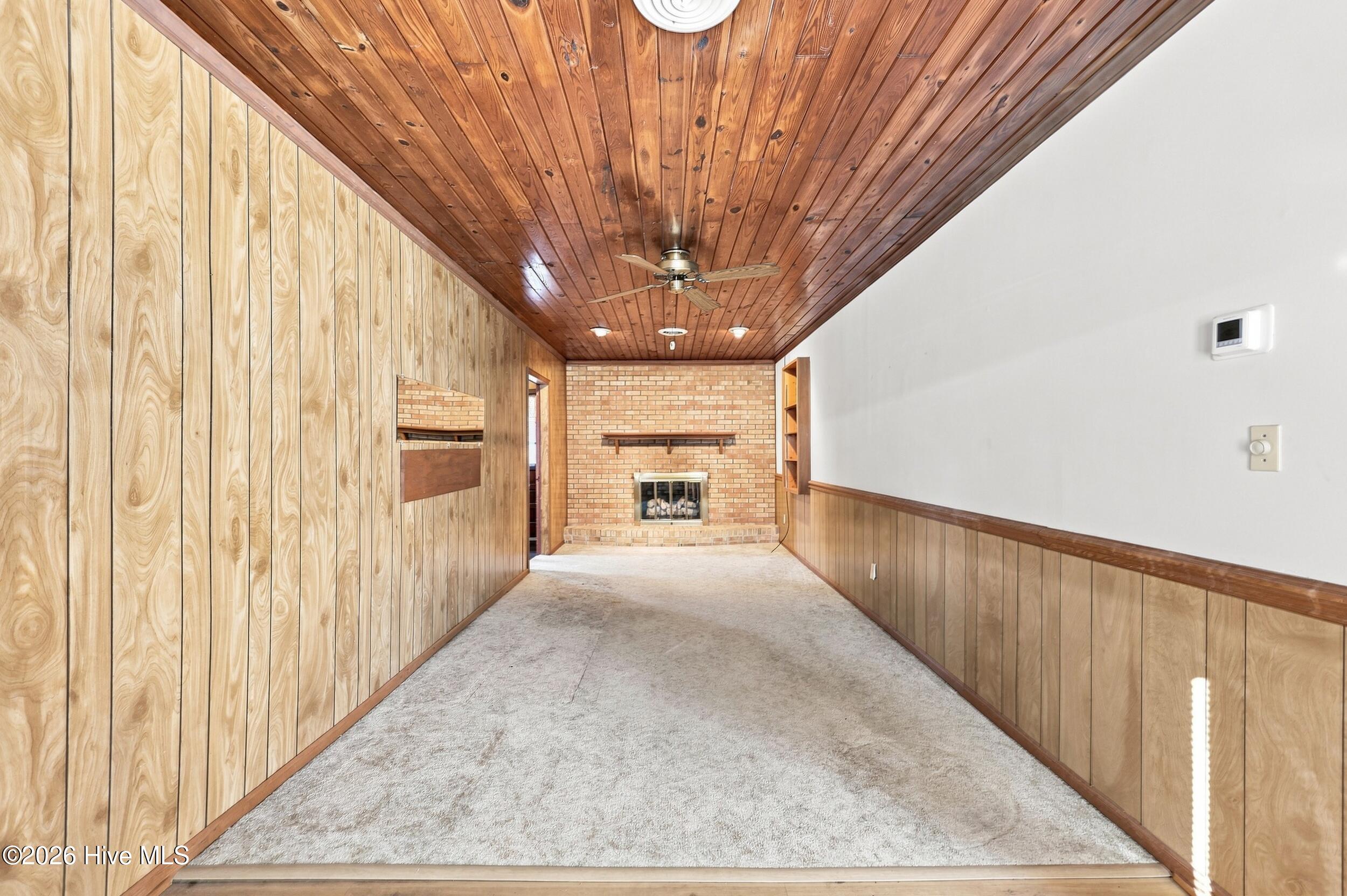 507 Narrow Shore Road Aydlett, NC 27916 - Photo 10 of 39 507 den new view toward fireplace