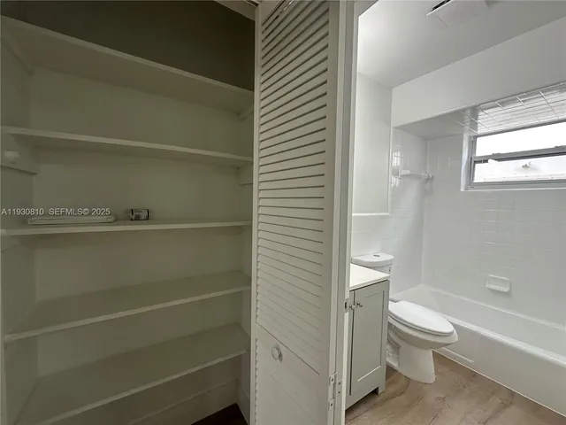 a bathroom with a toilet a sink and a bathtub