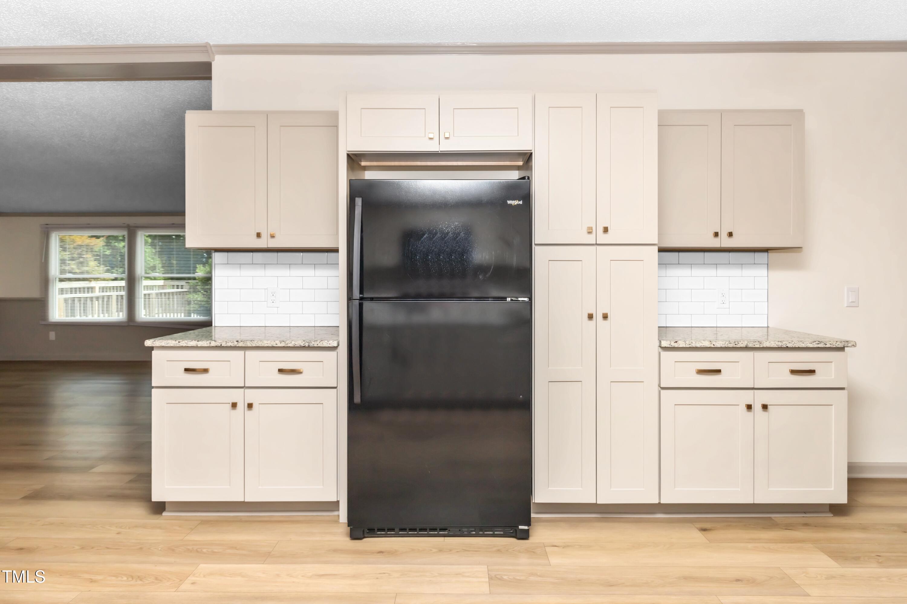165 Dawn Road Benson, NC 27504 - Photo 13 of 30 a kitchen with white cabinets and refrigerator