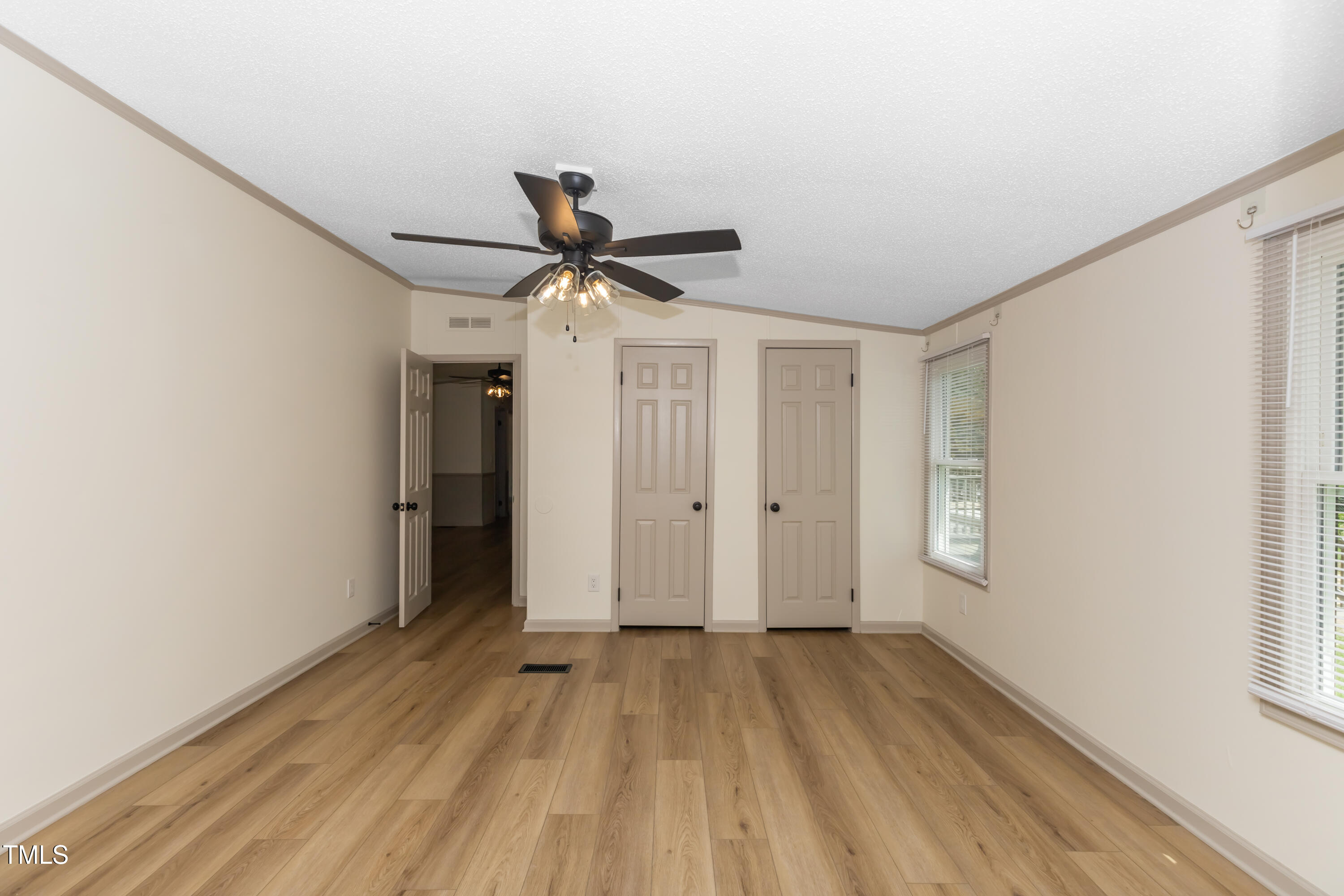 165 Dawn Road Benson, NC 27504 - Photo 17 of 30 a view of hallway with wooden floor and ceiling fan
