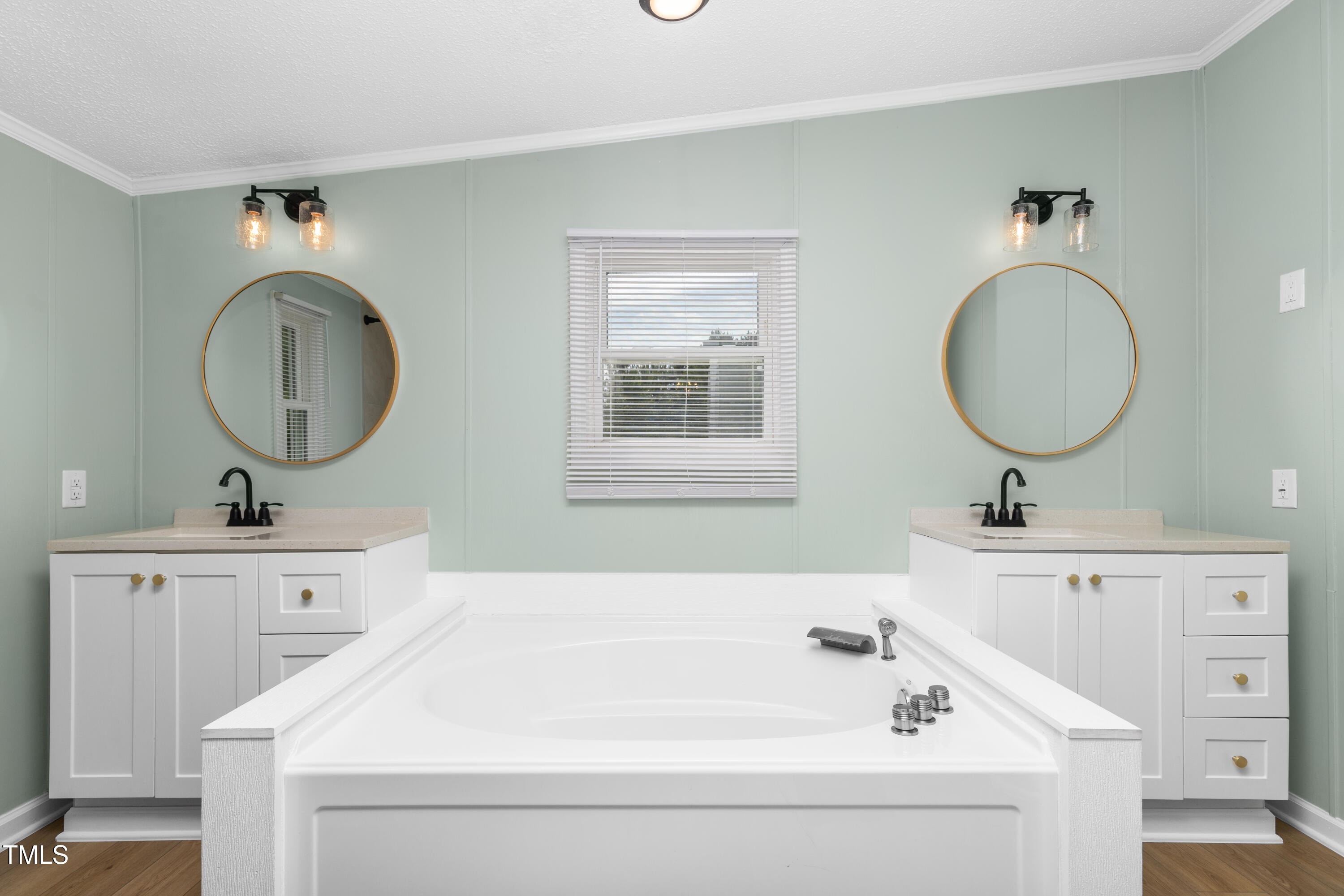 165 Dawn Road Benson, NC 27504 - Photo 19 of 30 a bathroom with a sink and a mirror
