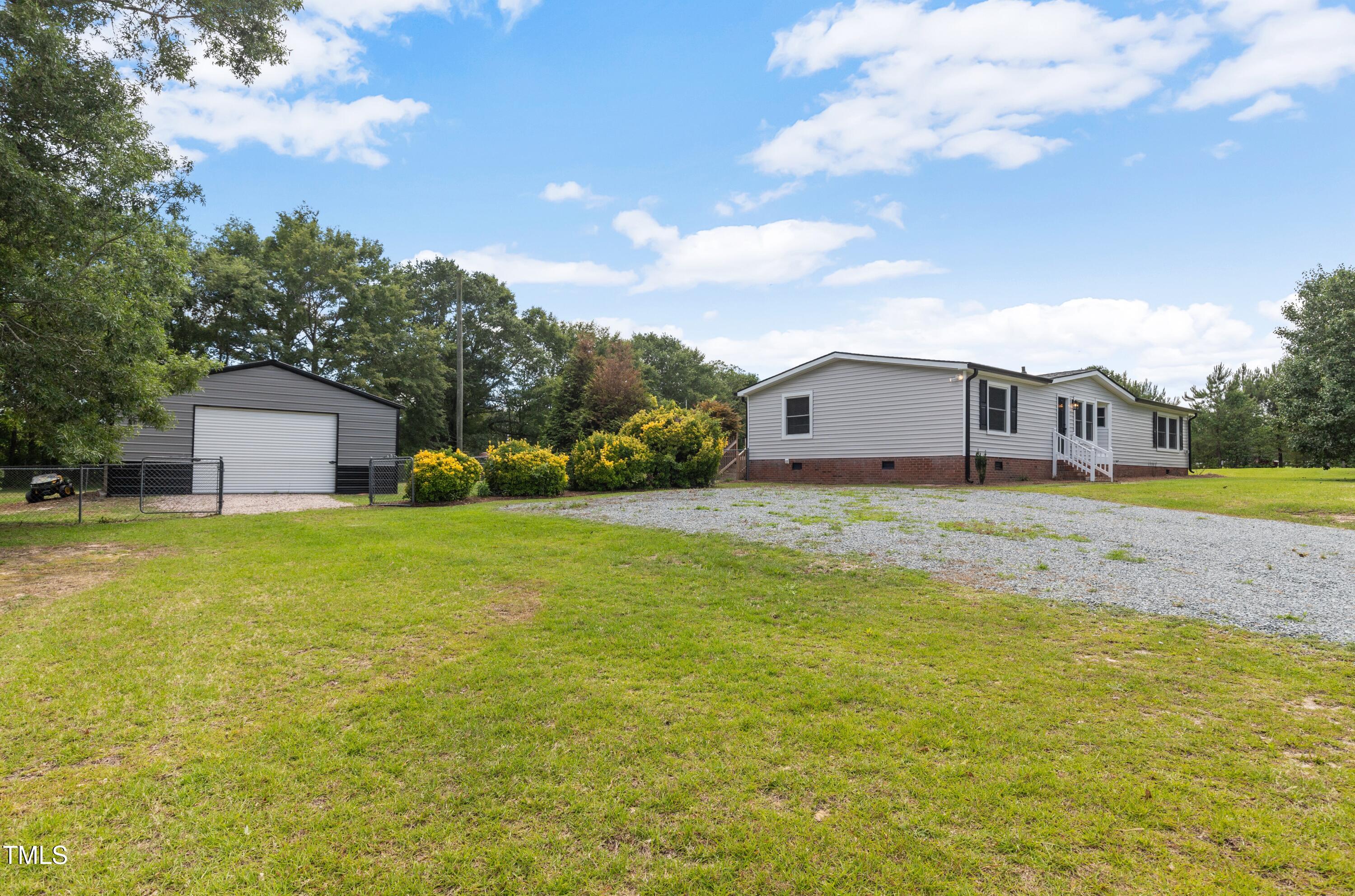 165 Dawn Road Benson, NC 27504 - Photo 27 of 30 a house view with a garden space