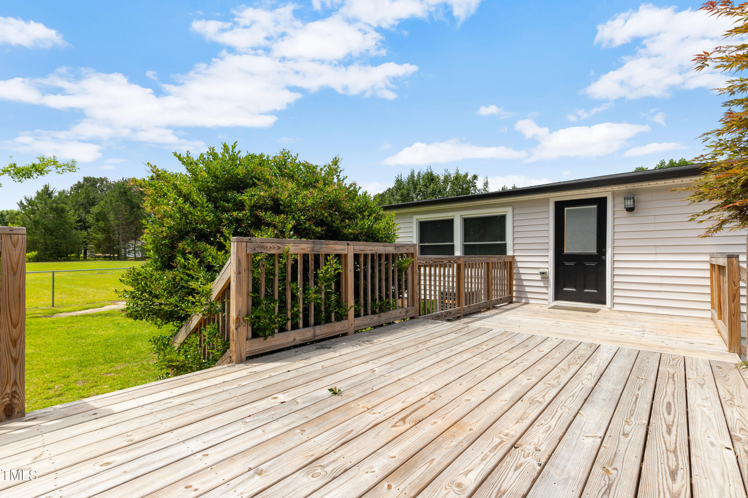 165 Dawn Road Benson, NC 27504 - Photo 29 of 30 a view of a house with a wooden deck
