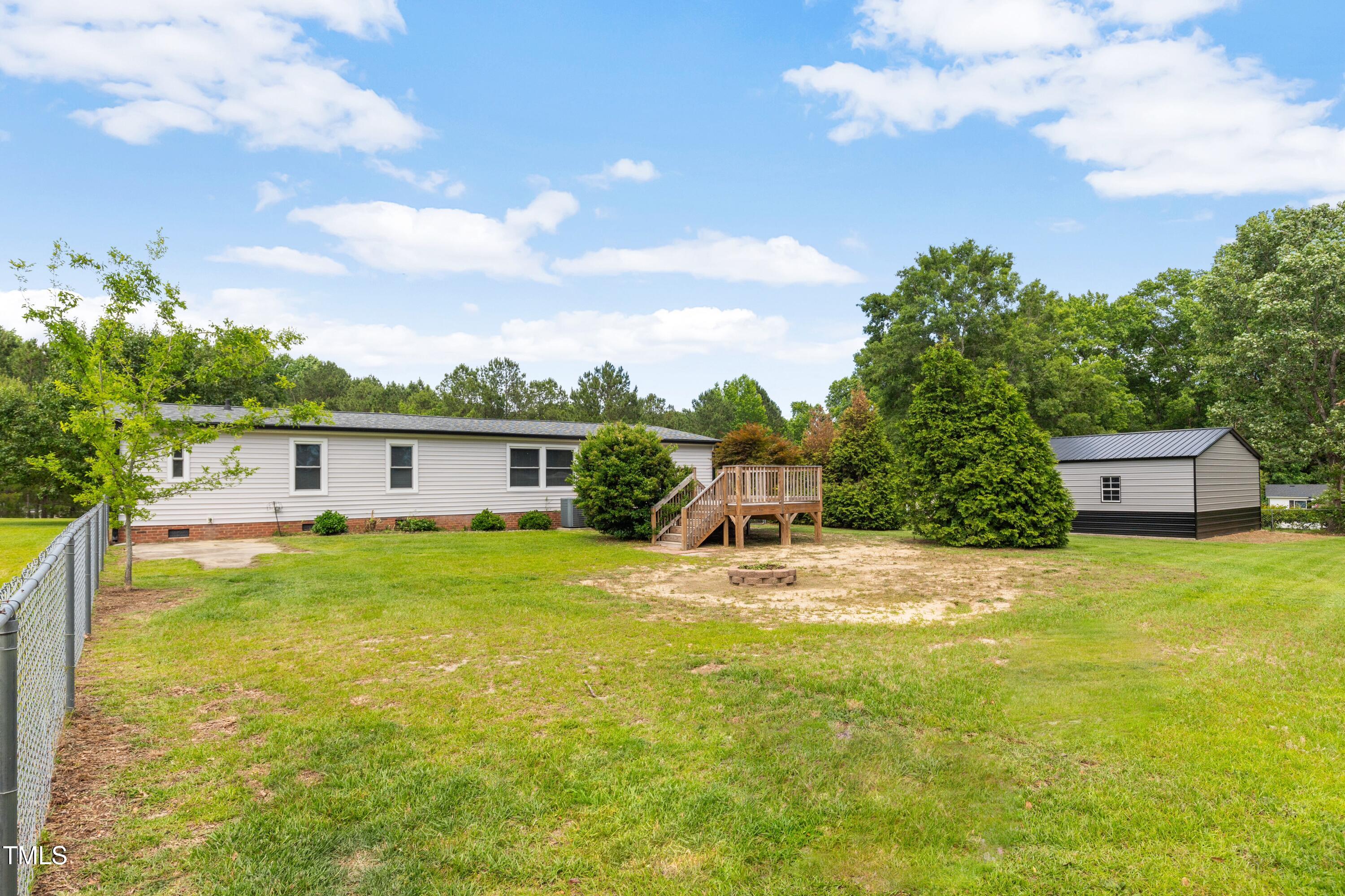 165 Dawn Road Benson, NC 27504 - Photo 30 of 30 a house view with swimming pool in front of it