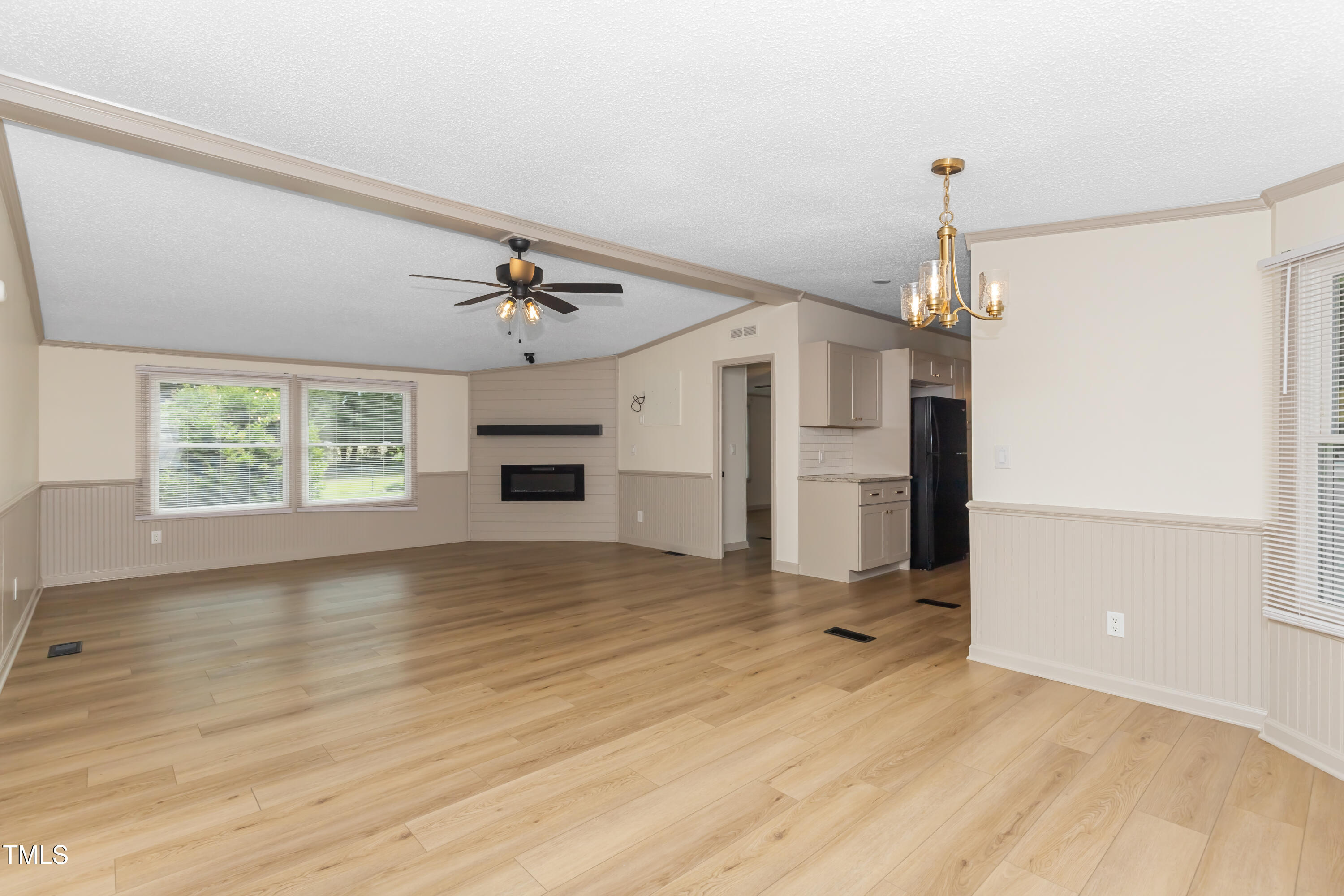 165 Dawn Road Benson, NC 27504 - Photo 7 of 30 a view of a kitchen with a sink and a refrigerator