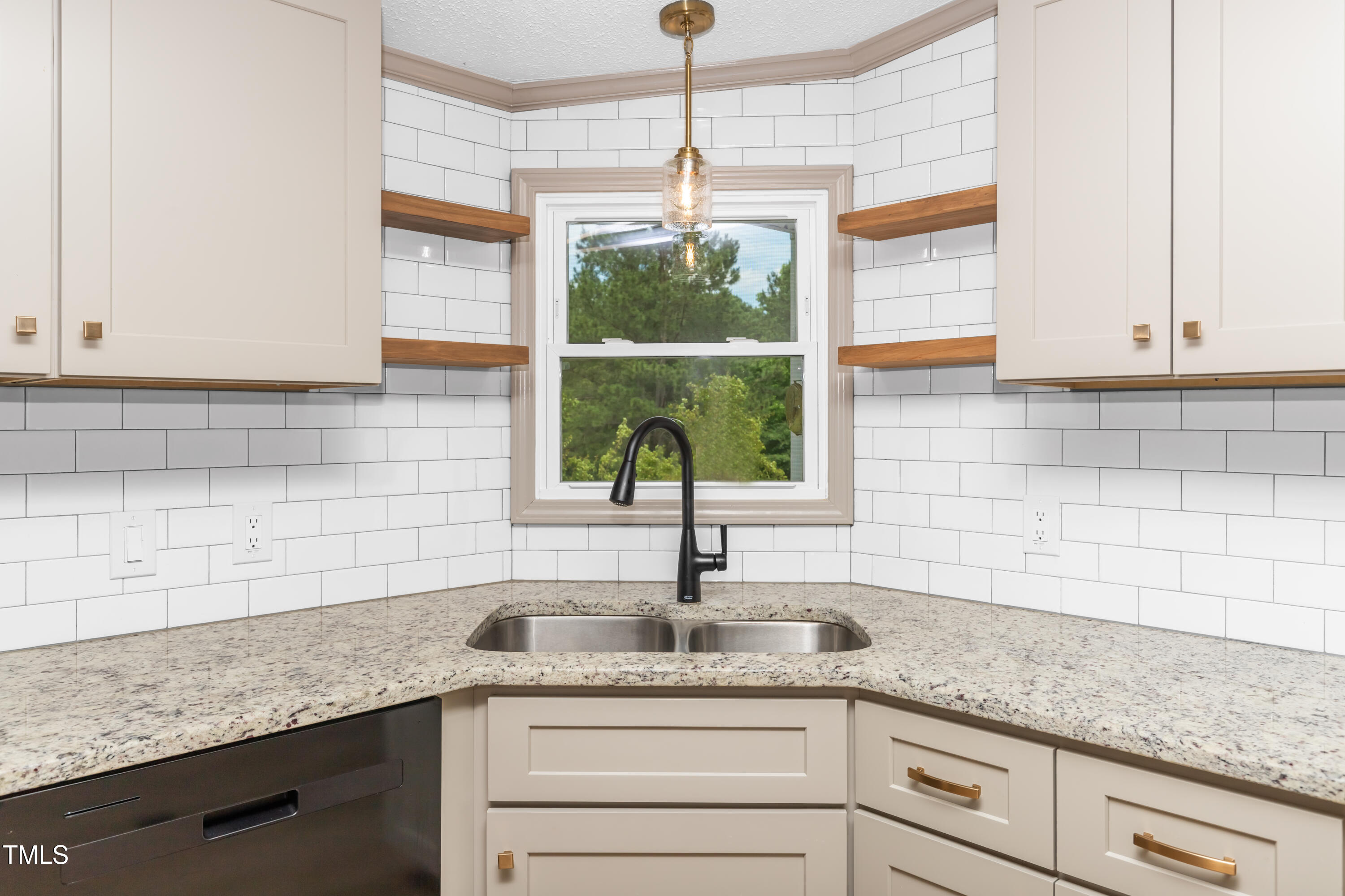 165 Dawn Road Benson, NC 27504 - Photo 8 of 30 a kitchen with granite countertop a sink and a window