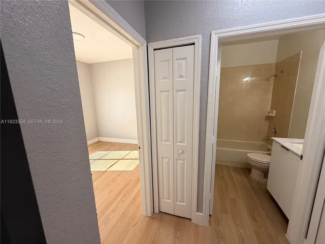 a view of a bathroom from a hallway
