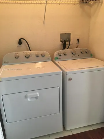 an empty room with wooden floor and closet