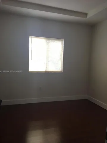 a kitchen with granite countertop a stove and a refrigerator