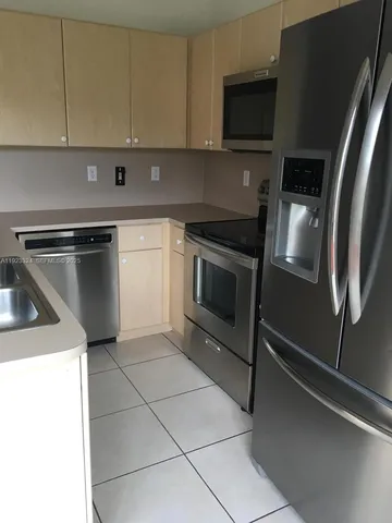 a living room with a bed and a table