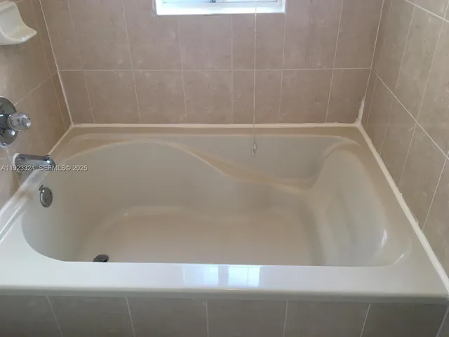 a close up of a bathtub in a bathroom