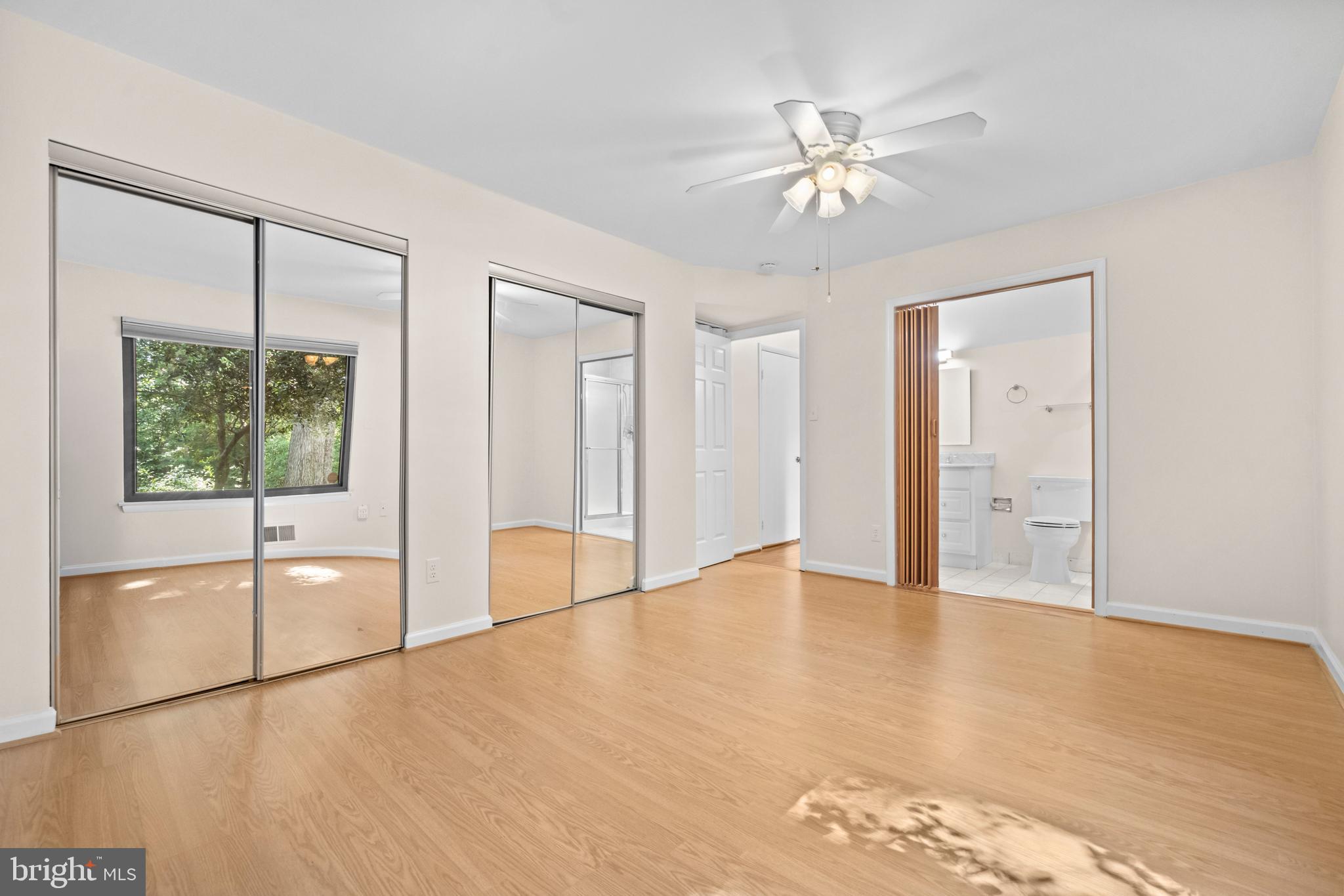 1413 Green Run Lane Reston, VA 20190 - Photo 18 of 50 a view of an empty room with window and wooden floor