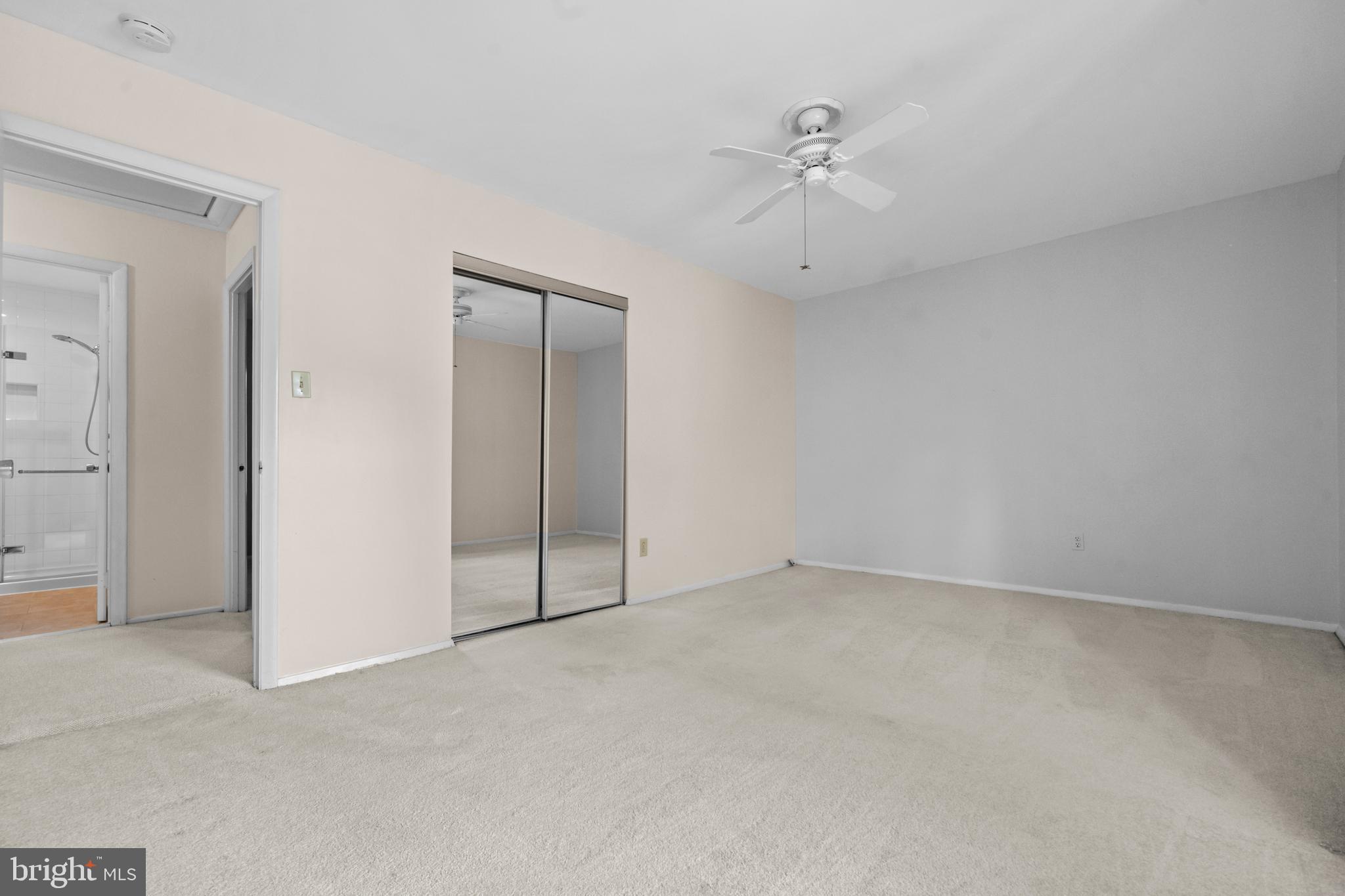 1413 Green Run Lane Reston, VA 20190 - Photo 23 of 50 an empty room with a ceiling fan and a window