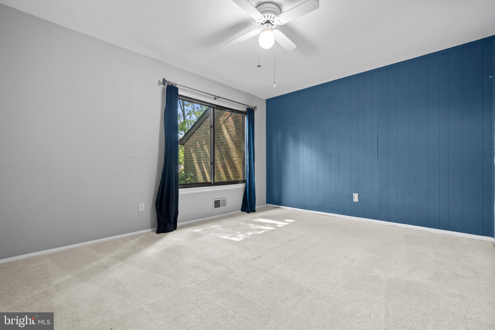 1413 Green Run Lane Reston, VA 20190 - Photo 24 of 50 a view of an empty room with a window