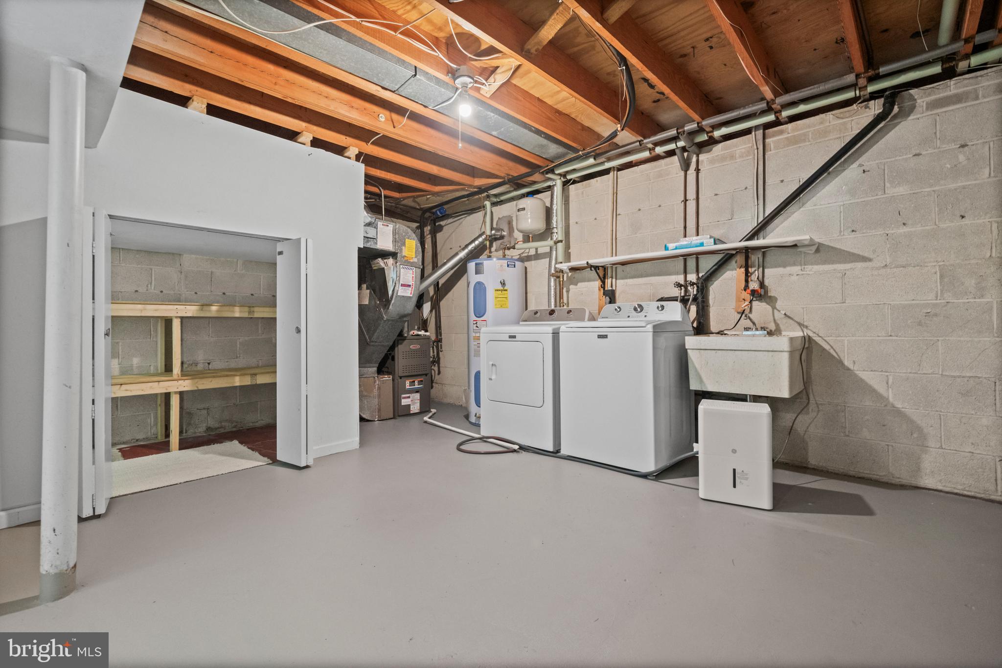 1413 Green Run Lane Reston, VA 20190 - Photo 30 of 50 a utility room with dryer and washer