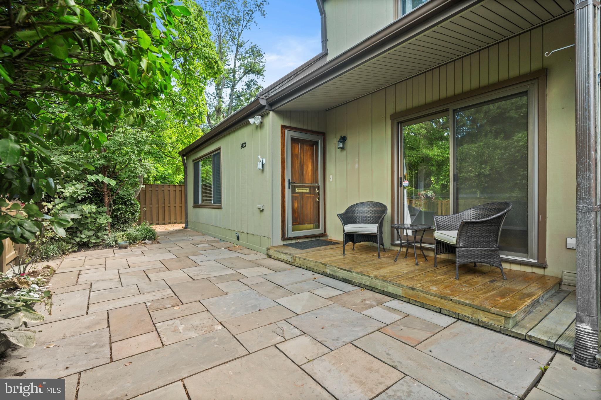 1413 Green Run Lane Reston, VA 20190 - Photo 3 of 50 a backyard of a house with seating space