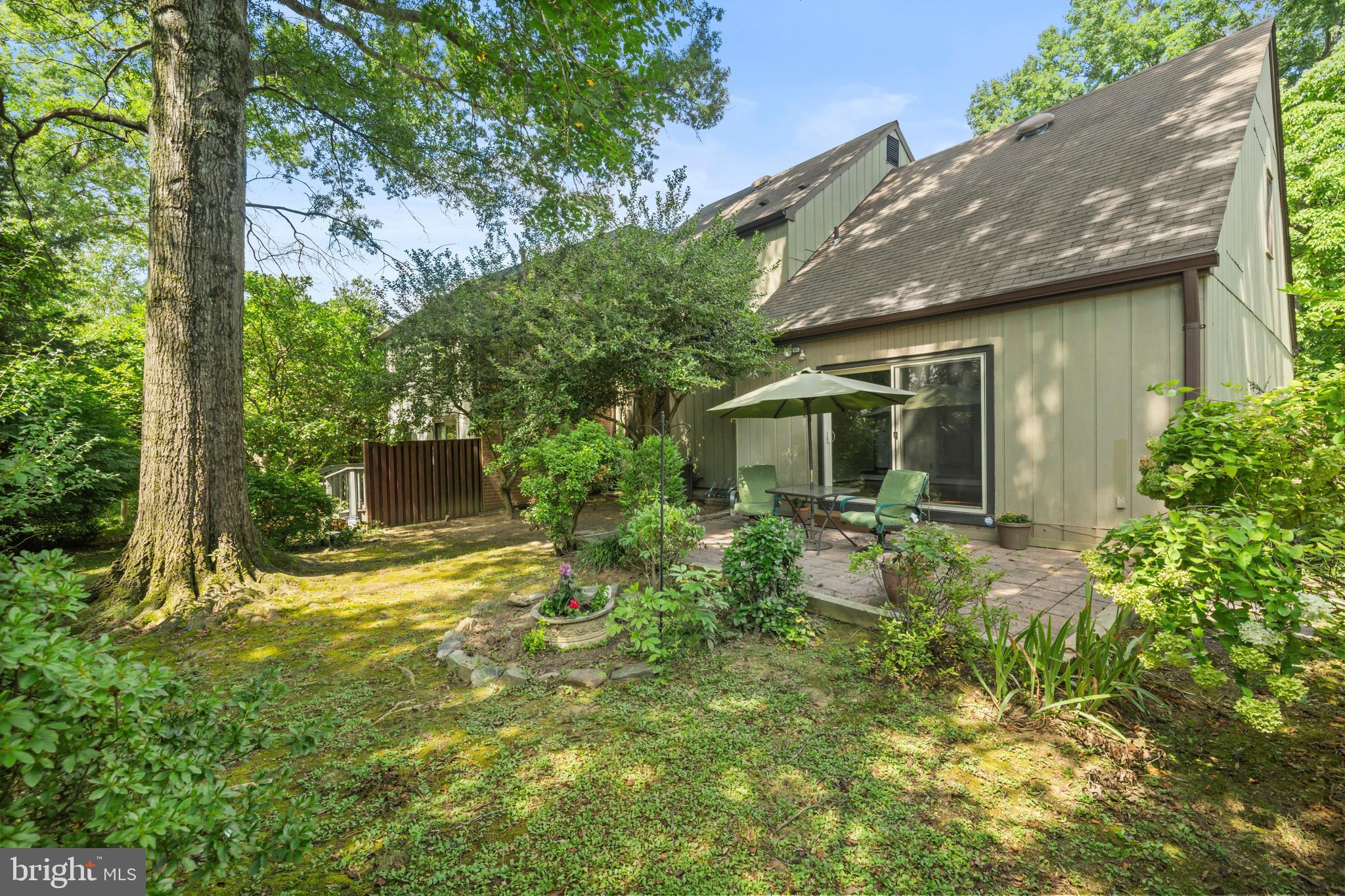 1413 Green Run Lane Reston, VA 20190 - Photo 34 of 50 a view of backyard of house with green space