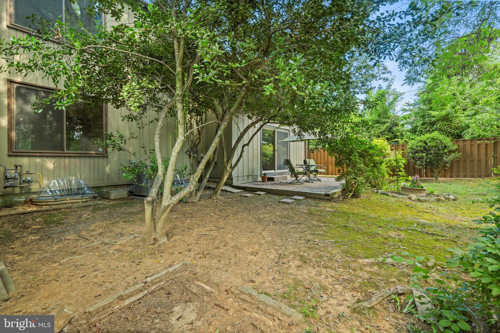 1413 Green Run Lane Reston, VA 20190 - Photo 36 of 50 a view of a house with backyard and trees