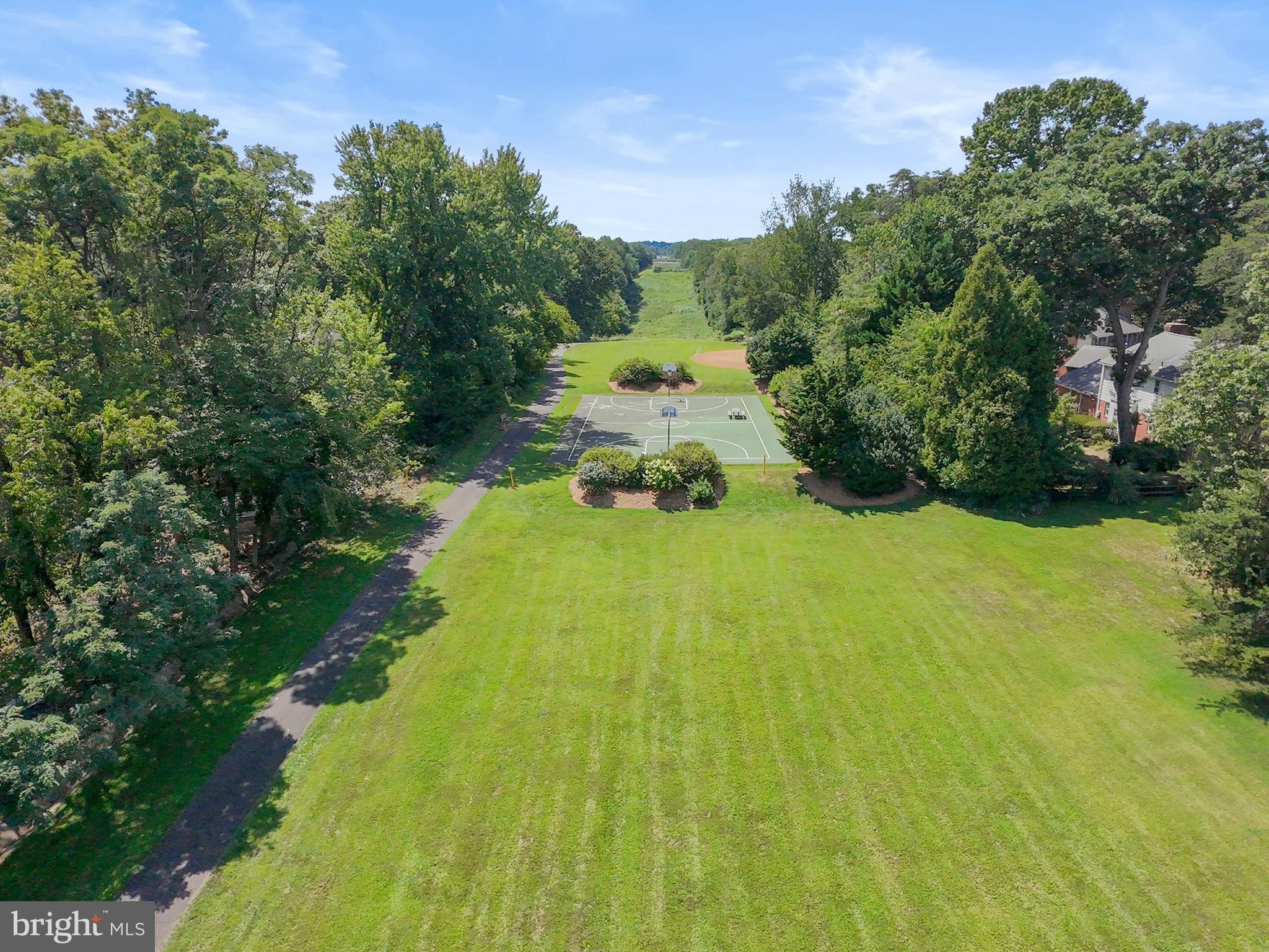 1413 Green Run Lane Reston, VA 20190 - Photo 47 of 50 a view of a lake with a yard