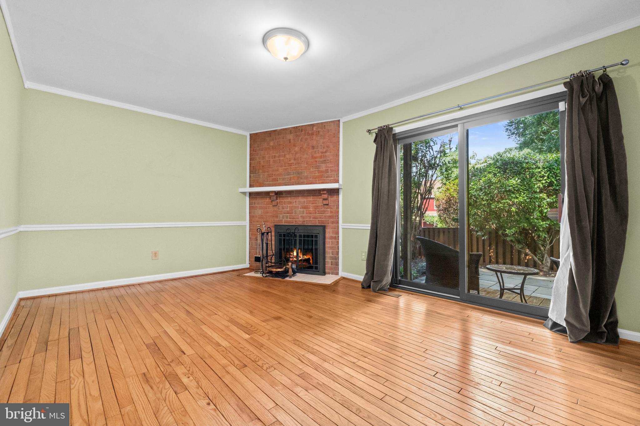 1413 Green Run Lane Reston, VA 20190 - Photo 5 of 50 wooden floor in an empty room with a fireplace