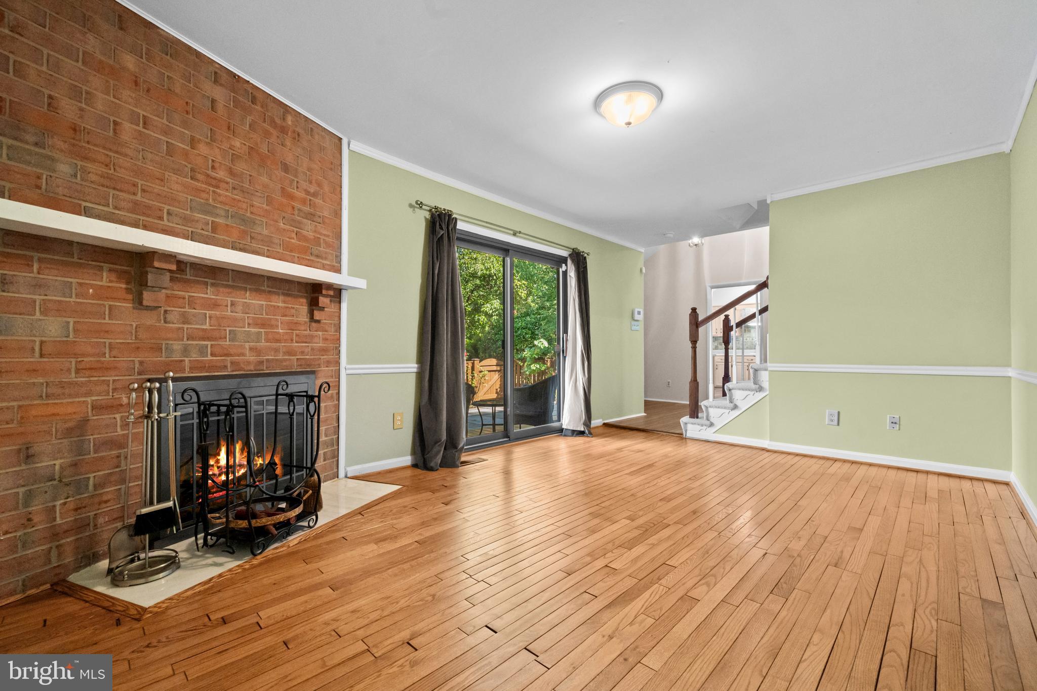 1413 Green Run Lane Reston, VA 20190 - Photo 6 of 50 a view of a room with wooden floor and windows