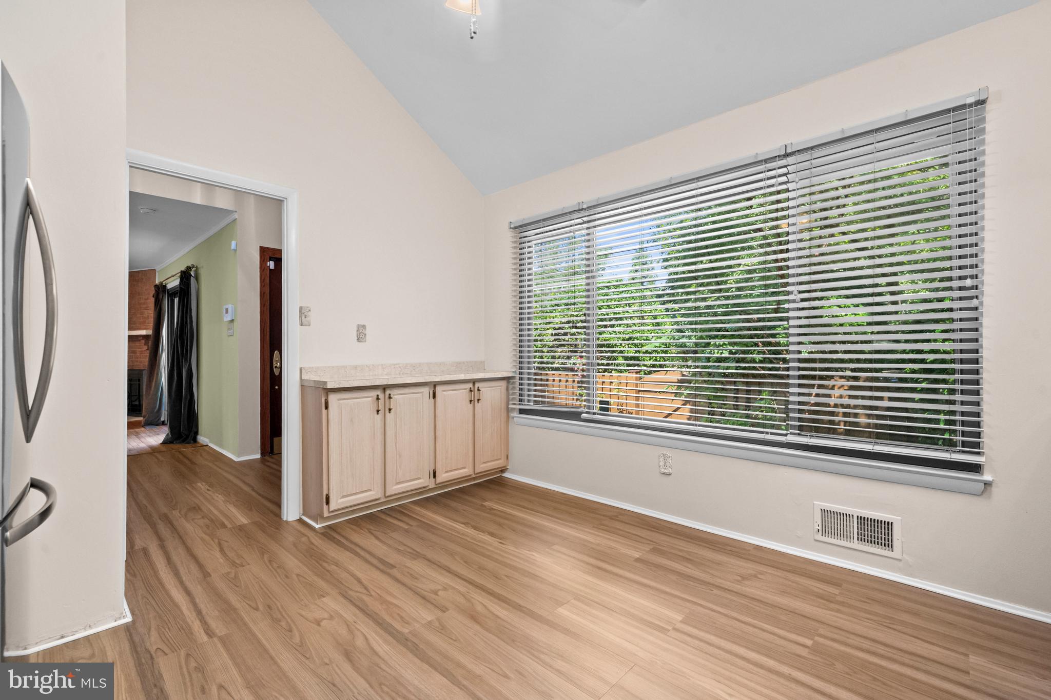 1413 Green Run Lane Reston, VA 20190 - Photo 9 of 50 a view of a room with wooden floor and windows