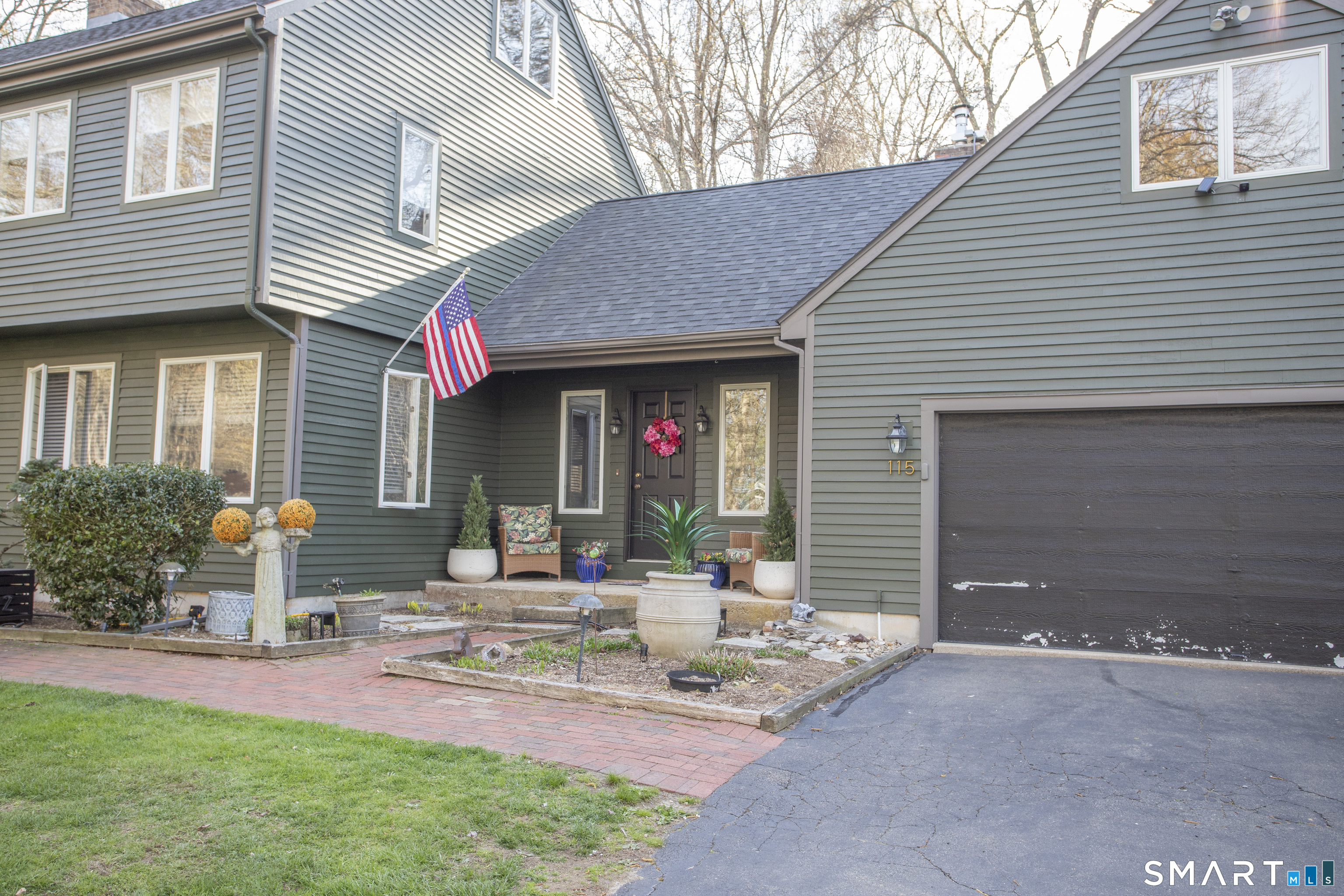 115 Ayers Point Road Old Saybrook, CT 06475 - Photo 2 of 34 a front view of a house with patio