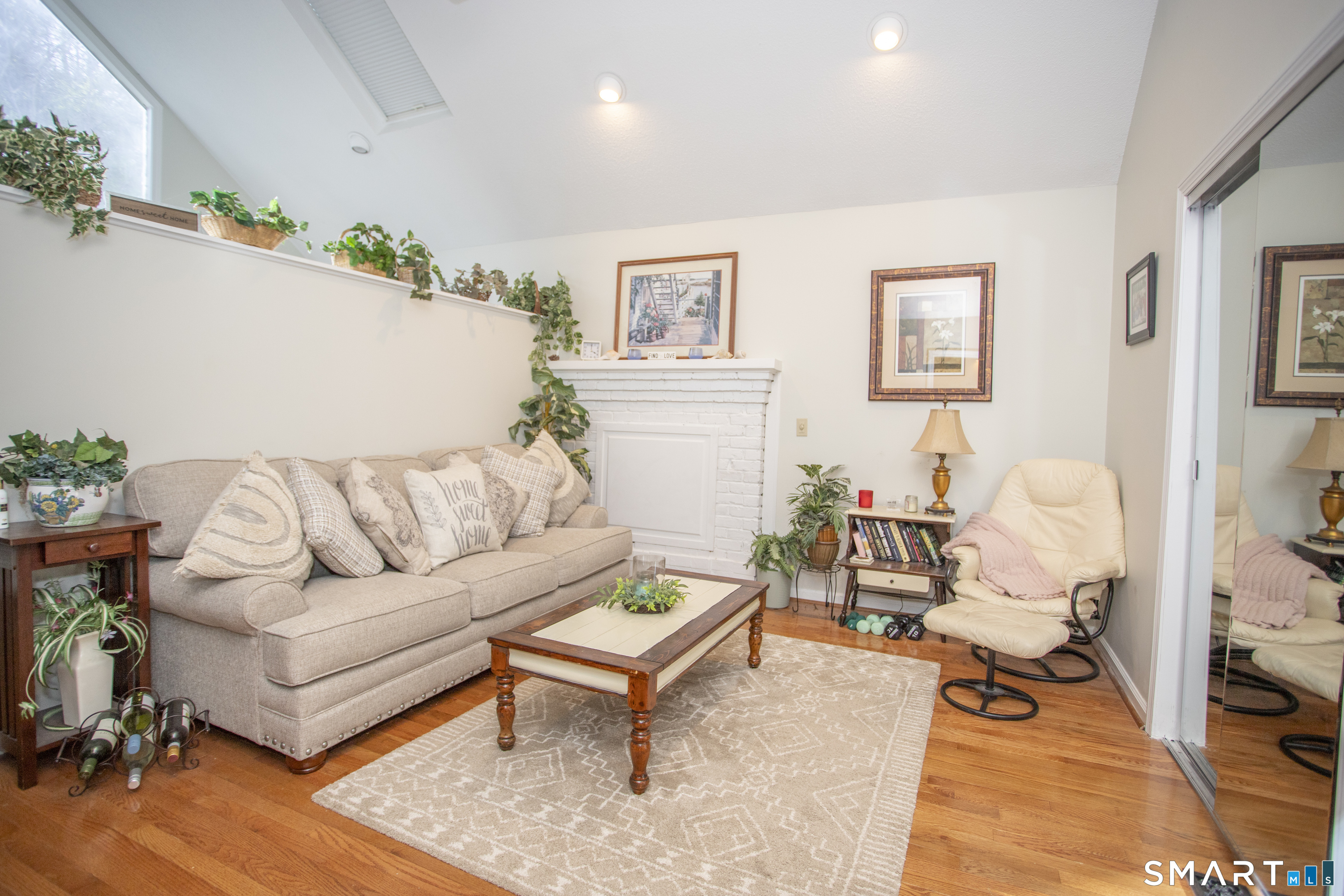 115 Ayers Point Road Old Saybrook, CT 06475 - Photo 3 of 34 a living room with furniture and wooden floor