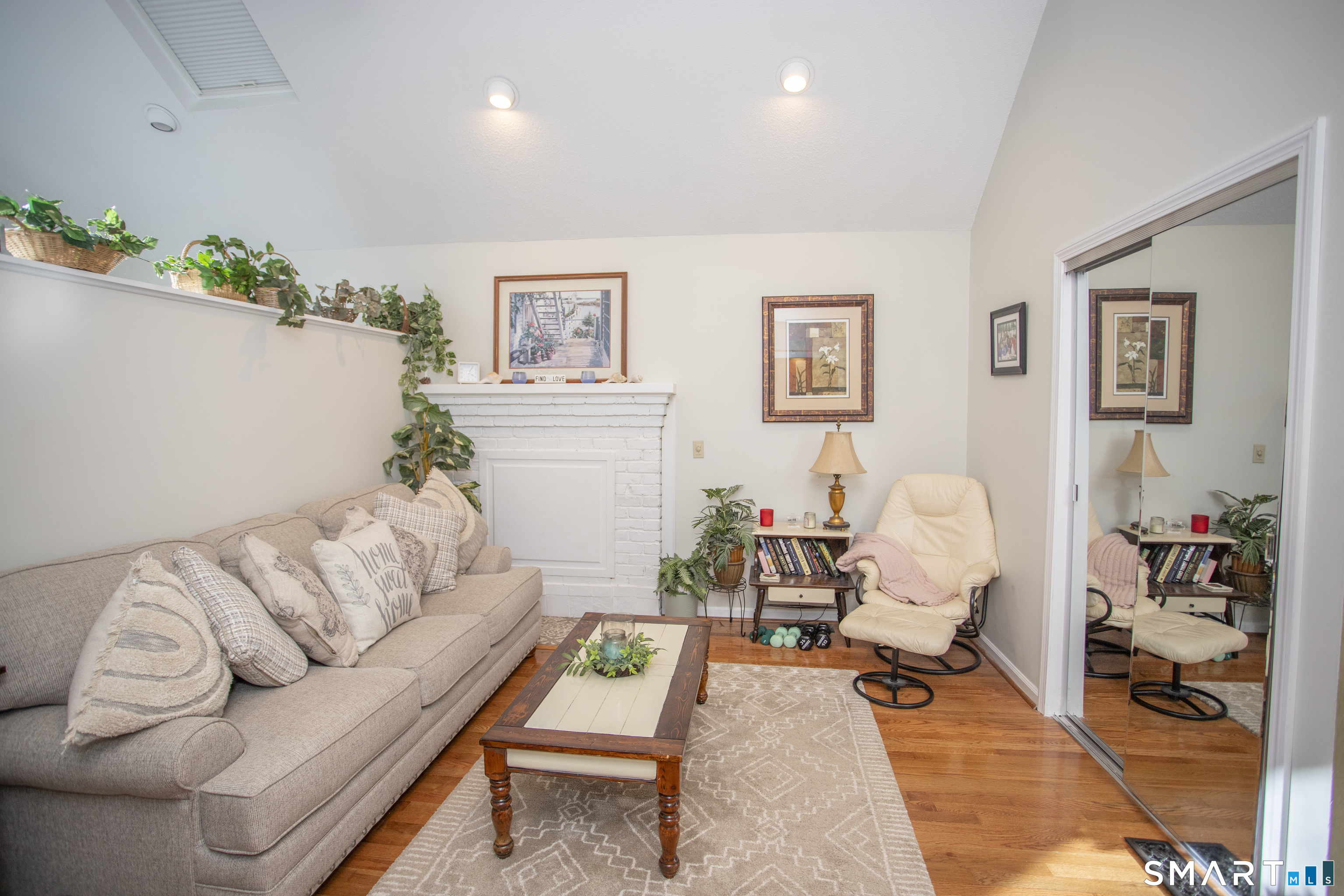 115 Ayers Point Road Old Saybrook, CT 06475 - Photo 4 of 34 a living room with furniture and wooden floor