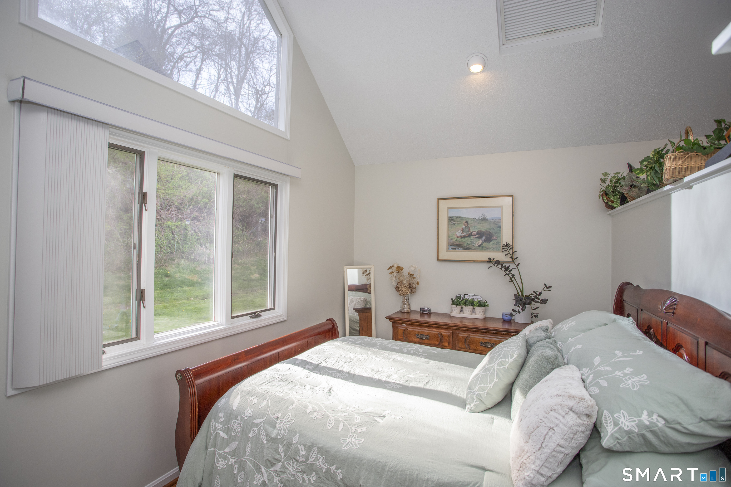 115 Ayers Point Road Old Saybrook, CT 06475 - Photo 8 of 34 a bedroom with a large bed and a window