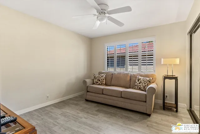 a living room with furniture and a window