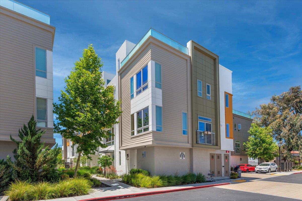 7961 Regional Common Dublin, CA 94568 - Photo 2 of 40 a front view of a house with a yard and garage