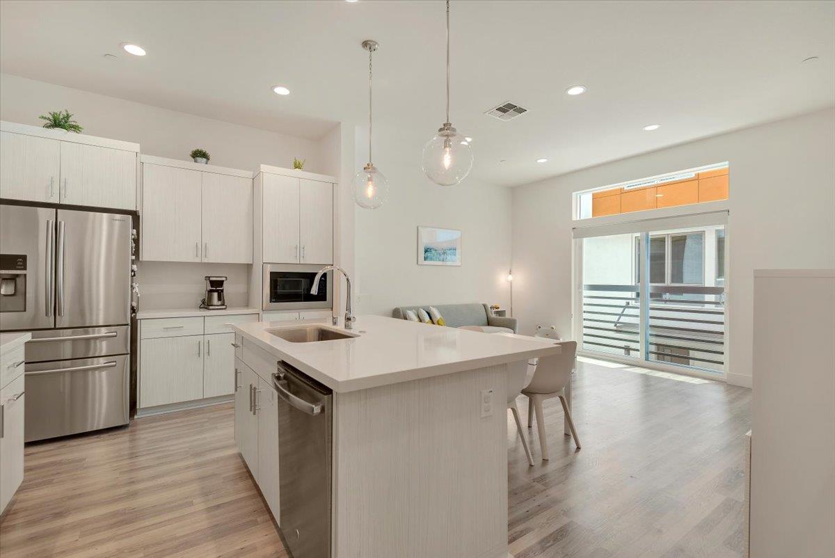 7961 Regional Common Dublin, CA 94568 - Photo 11 of 40 a kitchen with a sink stainless steel appliances and window