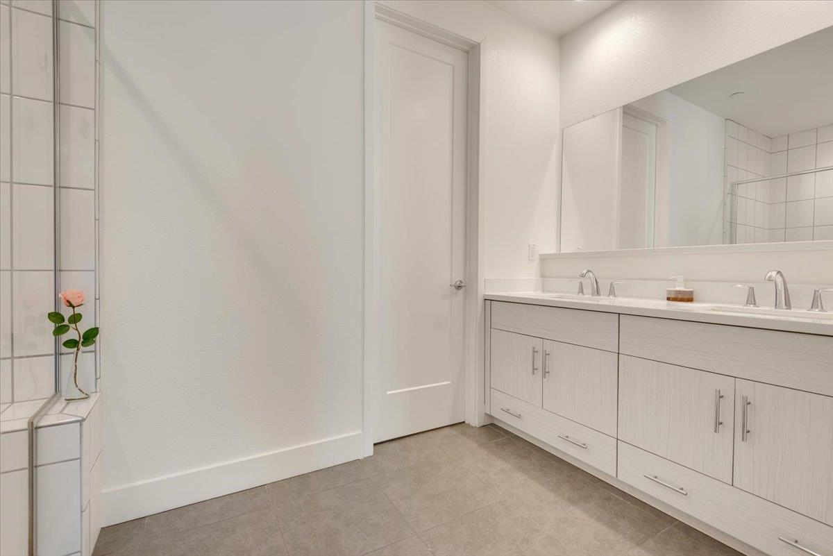 7961 Regional Common Dublin, CA 94568 - Photo 18 of 40 a bathroom with a sink and a mirror
