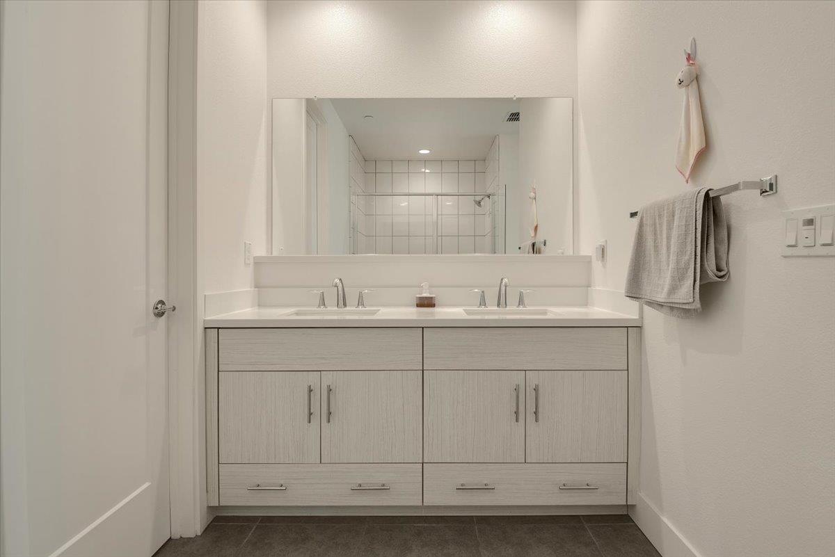 7961 Regional Common Dublin, CA 94568 - Photo 19 of 40 a bathroom with a sink and a mirror