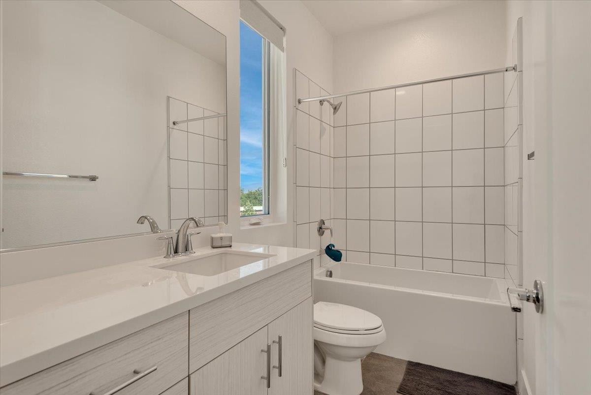 7961 Regional Common Dublin, CA 94568 - Photo 24 of 40 a bathroom with a sink a toilet and shower