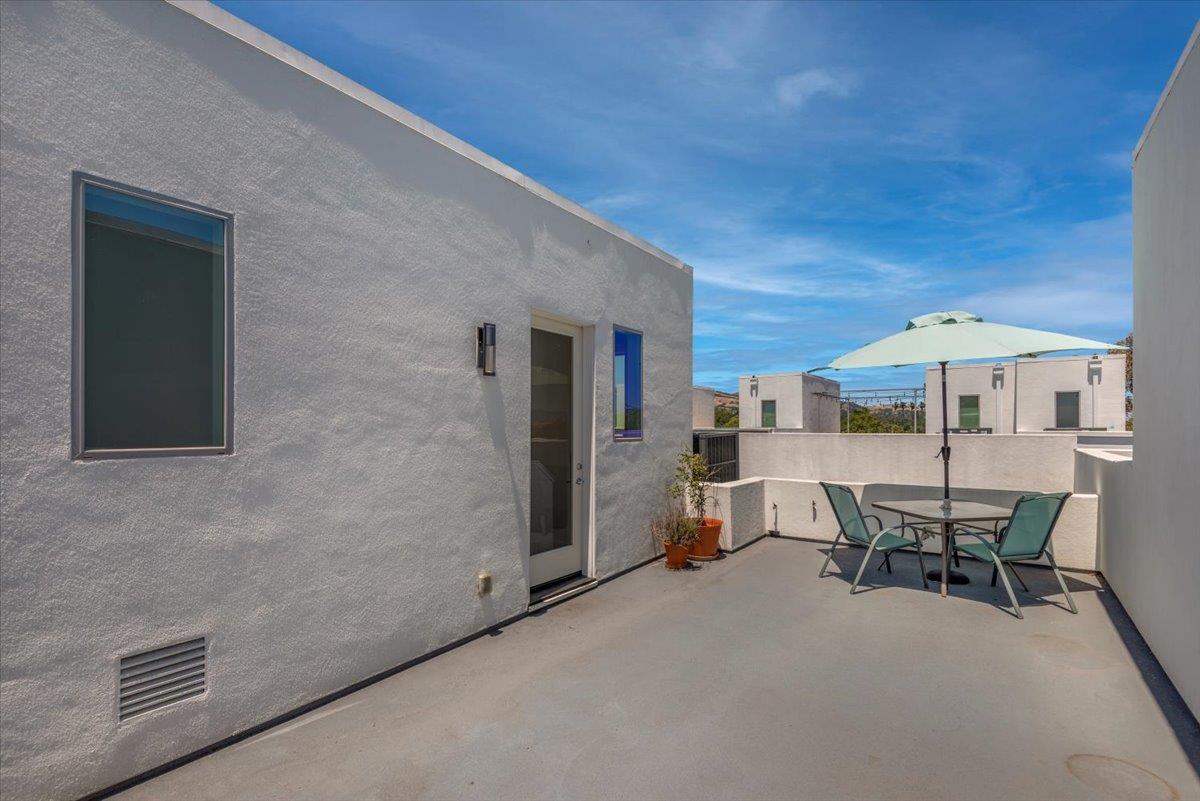 7961 Regional Common Dublin, CA 94568 - Photo 30 of 40 a dining room with furniture and a table