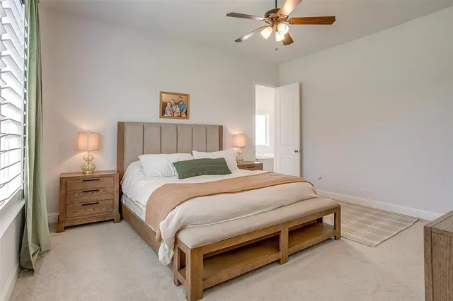 a bed room with a bed and a chandelier