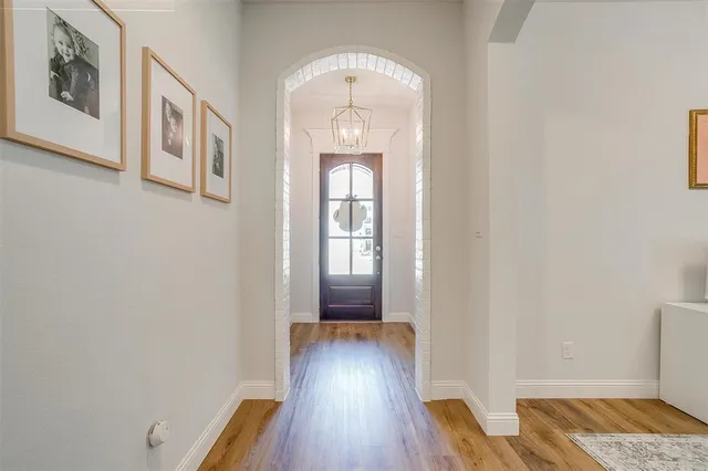 a view of an entryway with wooden floor