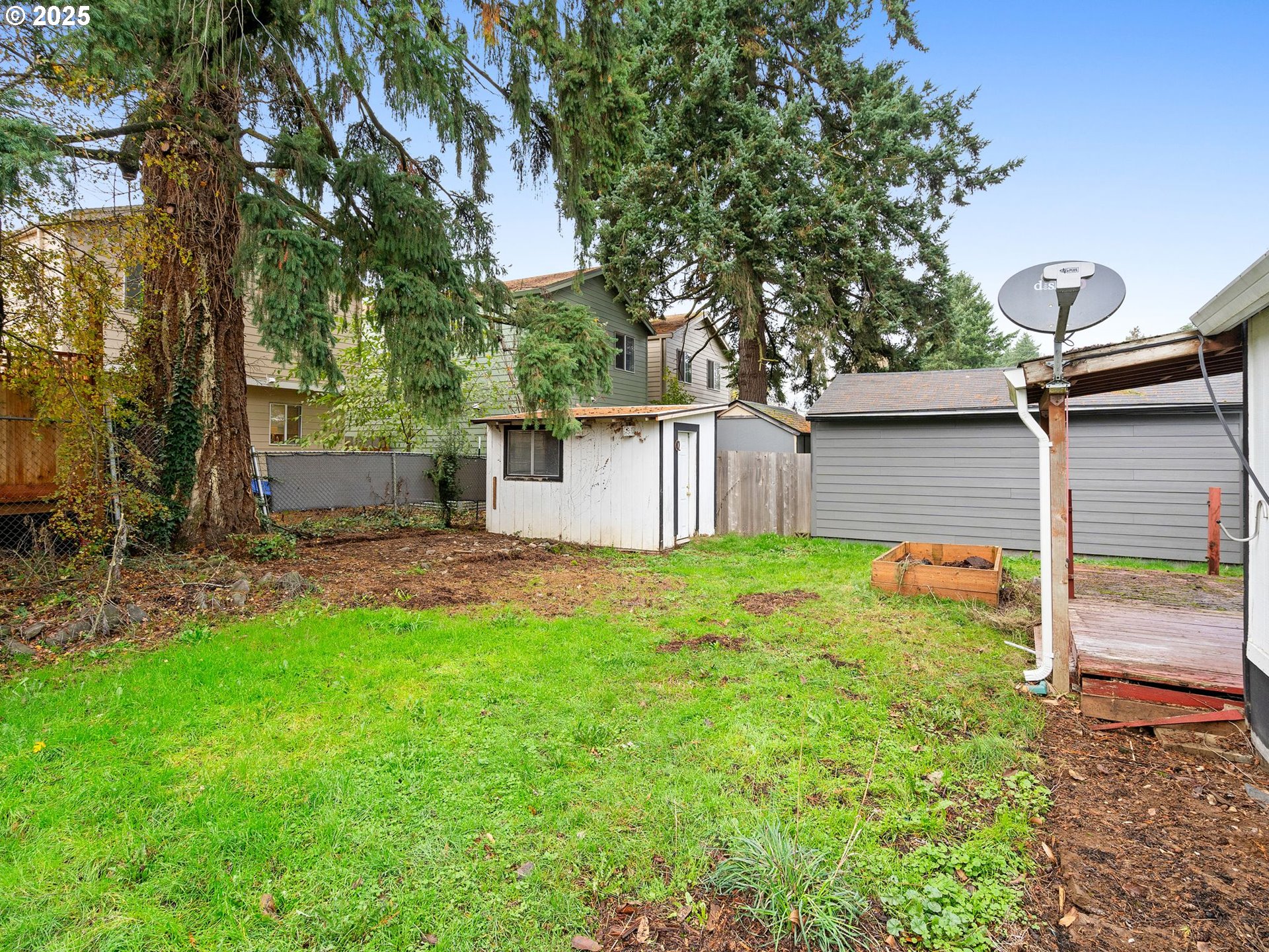 6009 Southeast 138th Place Portland, OR 97236 - Photo 20 of 37 a backyard of a house with table and chairs