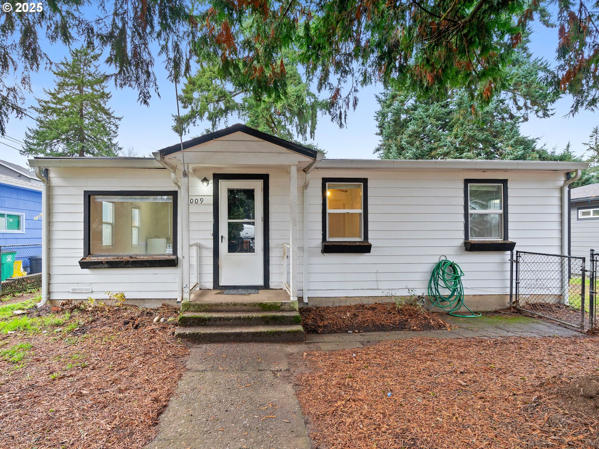 6009 Southeast 138th Place Portland, OR 97236 - Photo 2 of 37 a front view of a house with garden