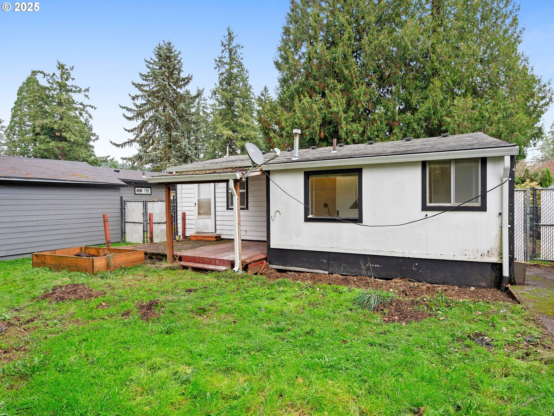 6009 Southeast 138th Place Portland, OR 97236 - Photo 25 of 37 a front view of a house with a yard and porch