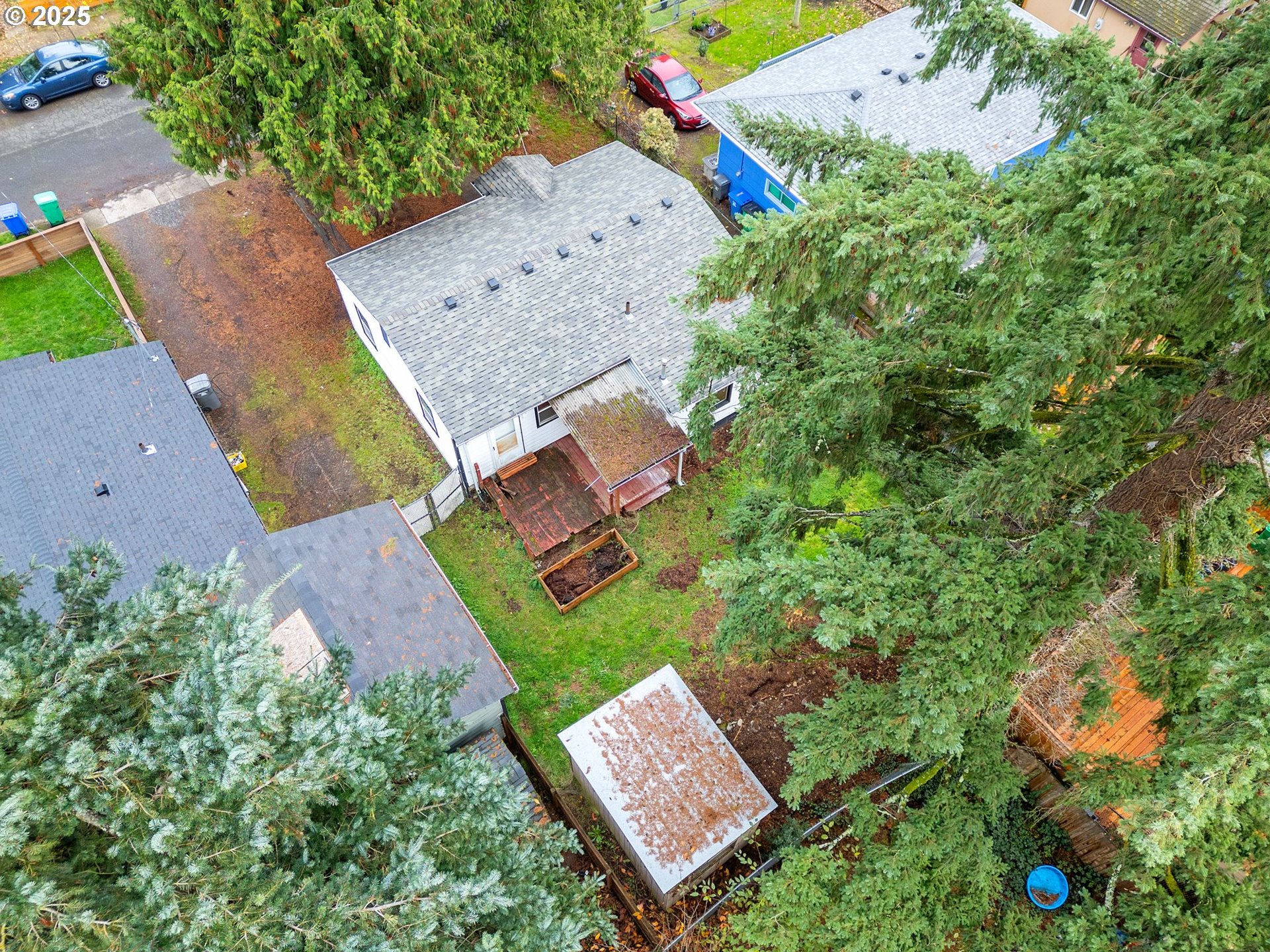6009 Southeast 138th Place Portland, OR 97236 - Photo 29 of 37 an aerial view of a house with a yard