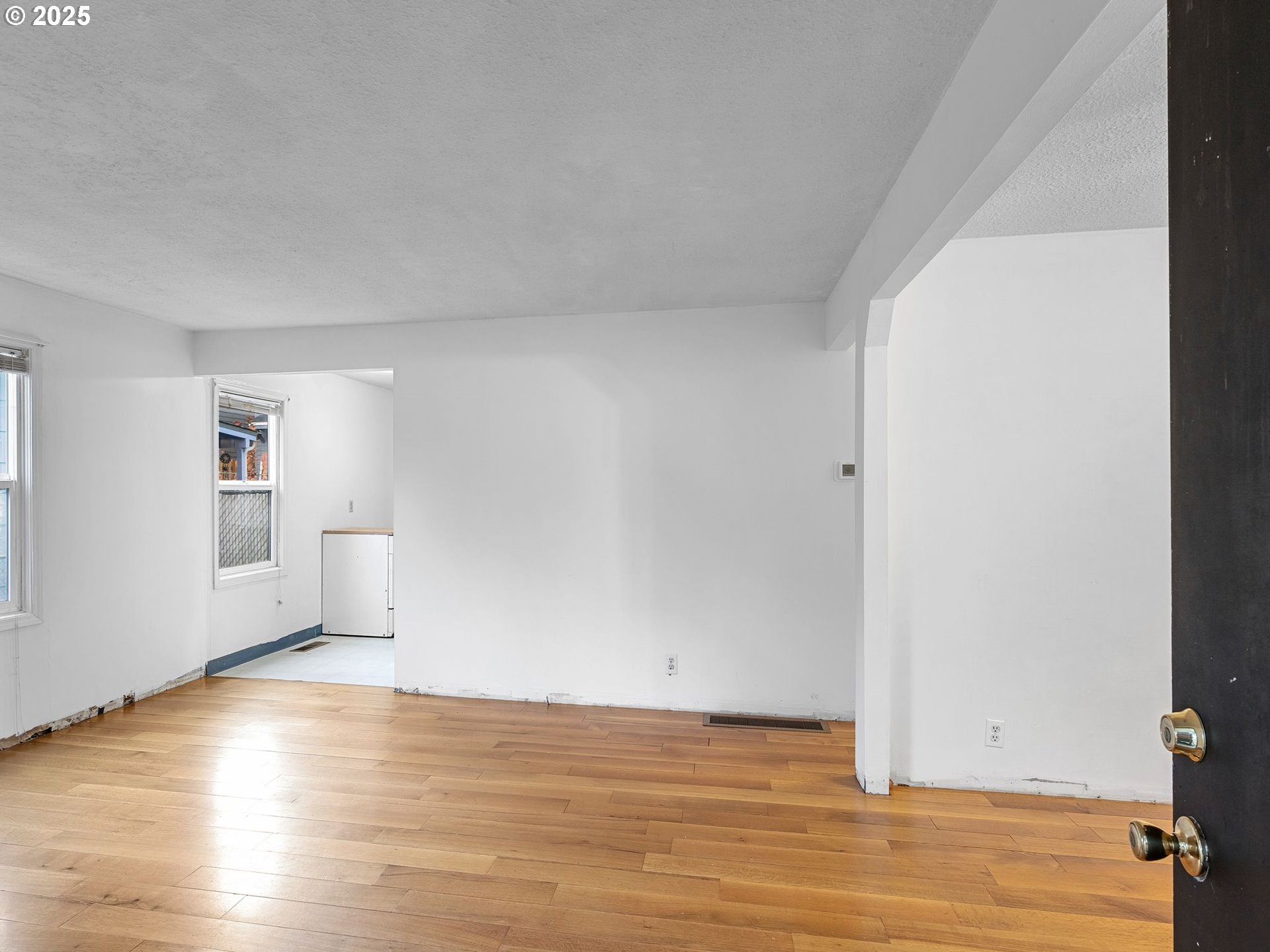 6009 Southeast 138th Place Portland, OR 97236 - Photo 3 of 37 a view of empty room with wooden floor