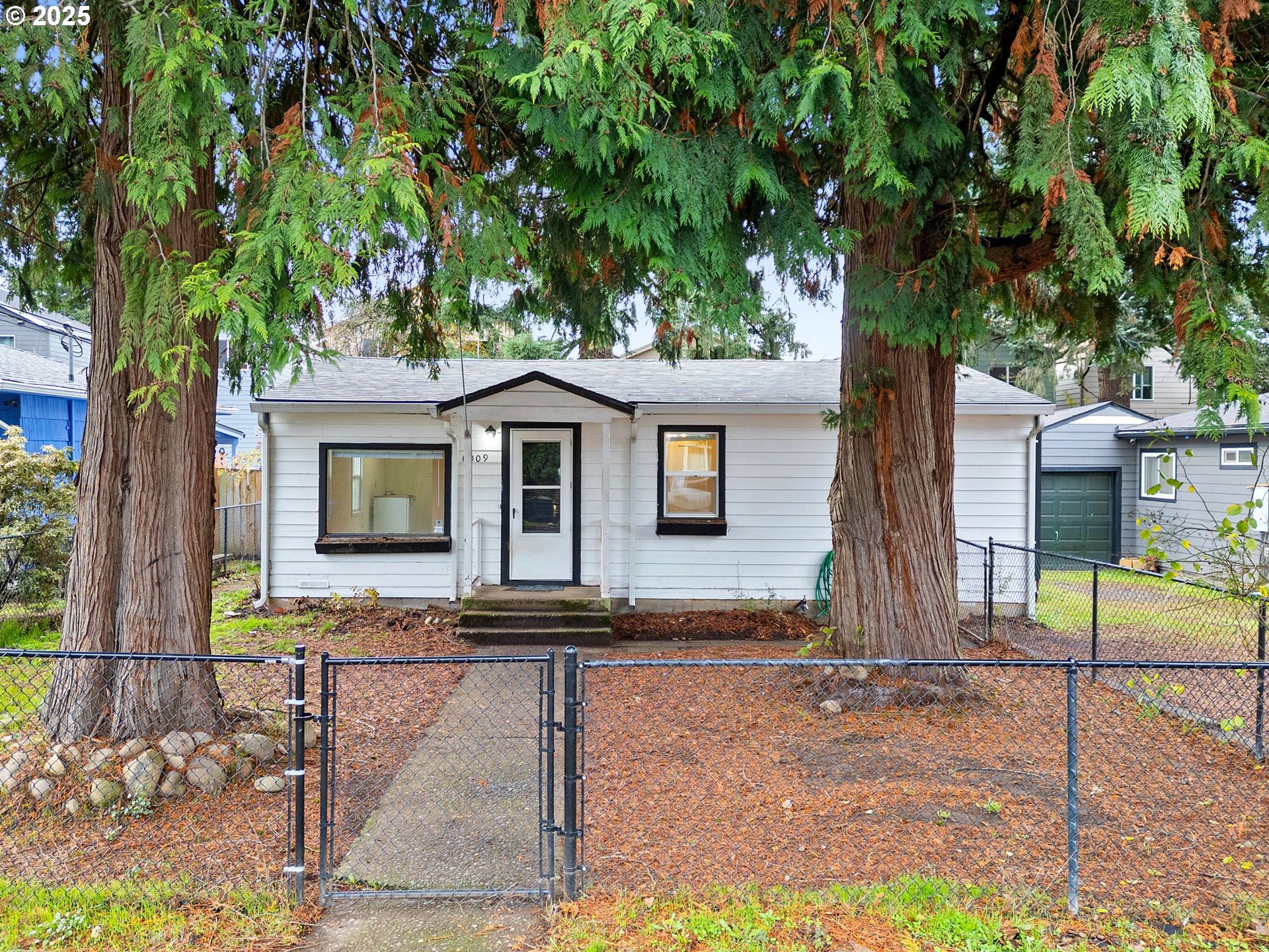 6009 Southeast 138th Place Portland, OR 97236 - Photo 34 of 37 a front view of house with yard