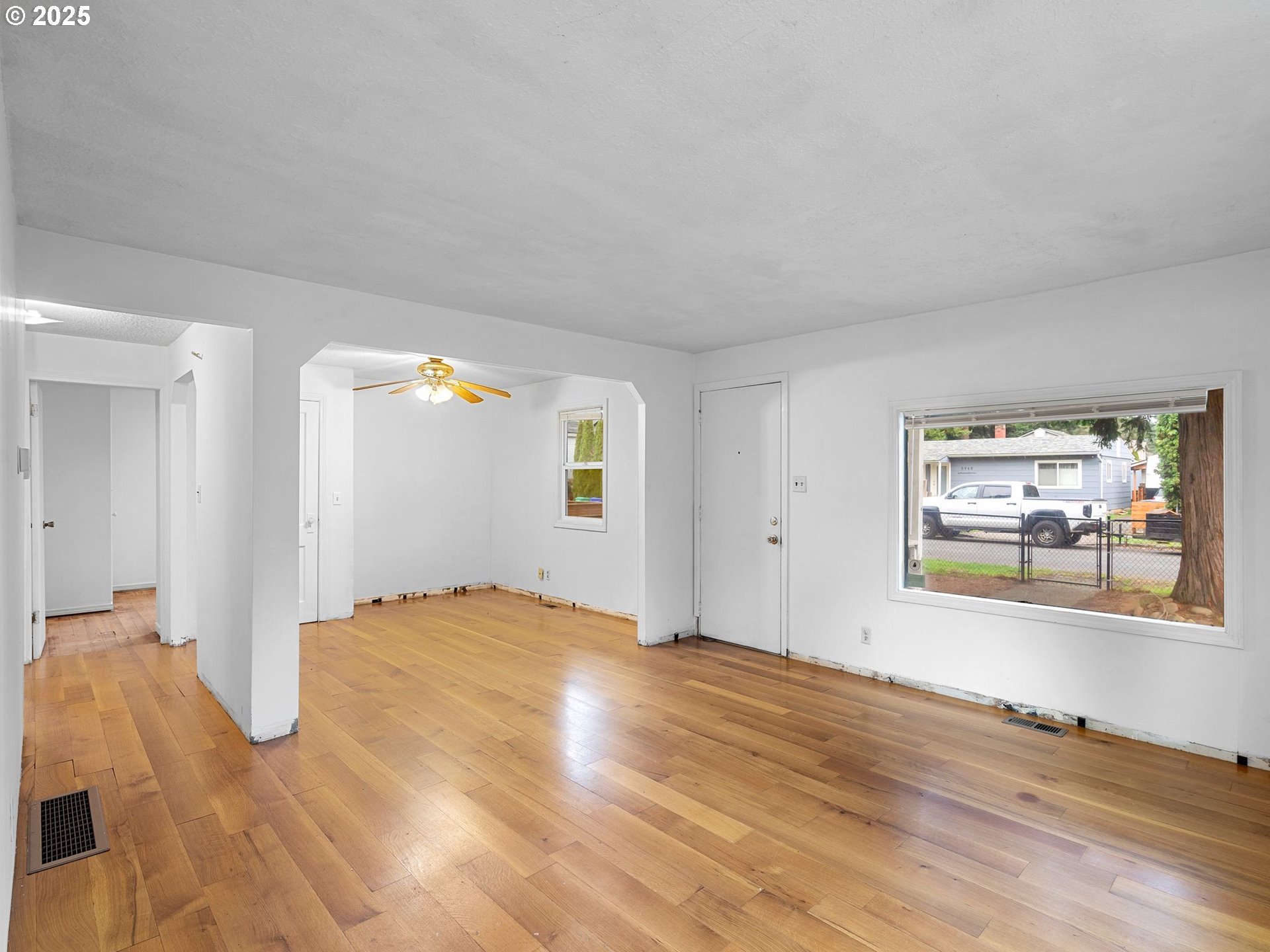6009 Southeast 138th Place Portland, OR 97236 - Photo 6 of 37 a view of a bedroom with wooden floor and window