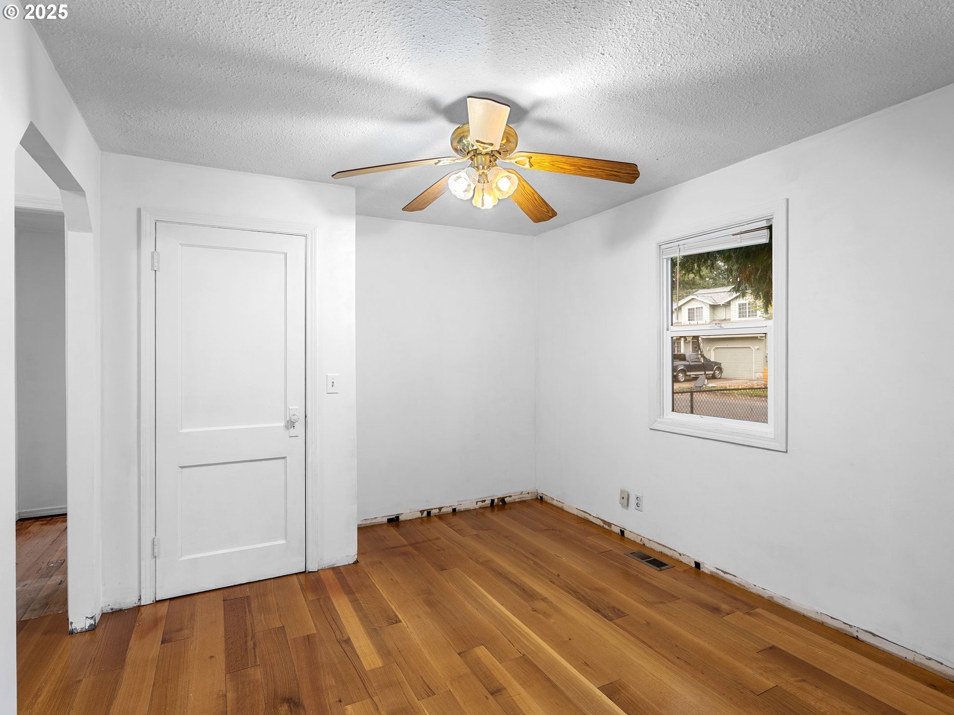 6009 Southeast 138th Place Portland, OR 97236 - Photo 10 of 37 a view of empty room with wooden floor