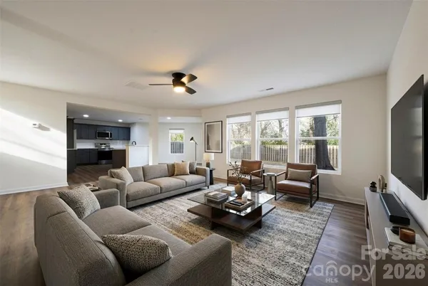 a living room with furniture and a flat screen tv