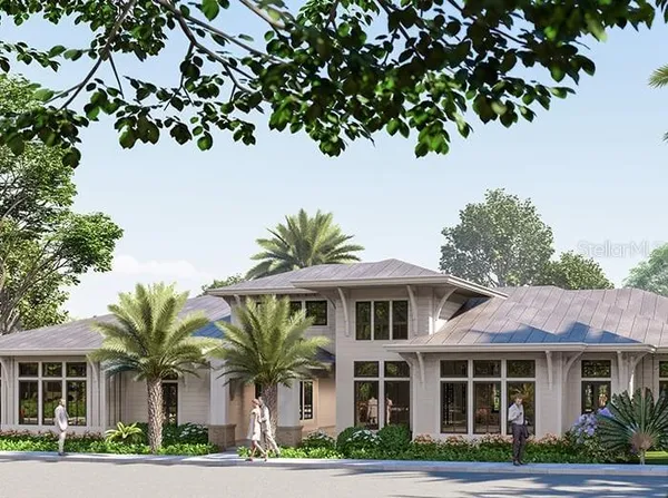 front view of a house with a tree